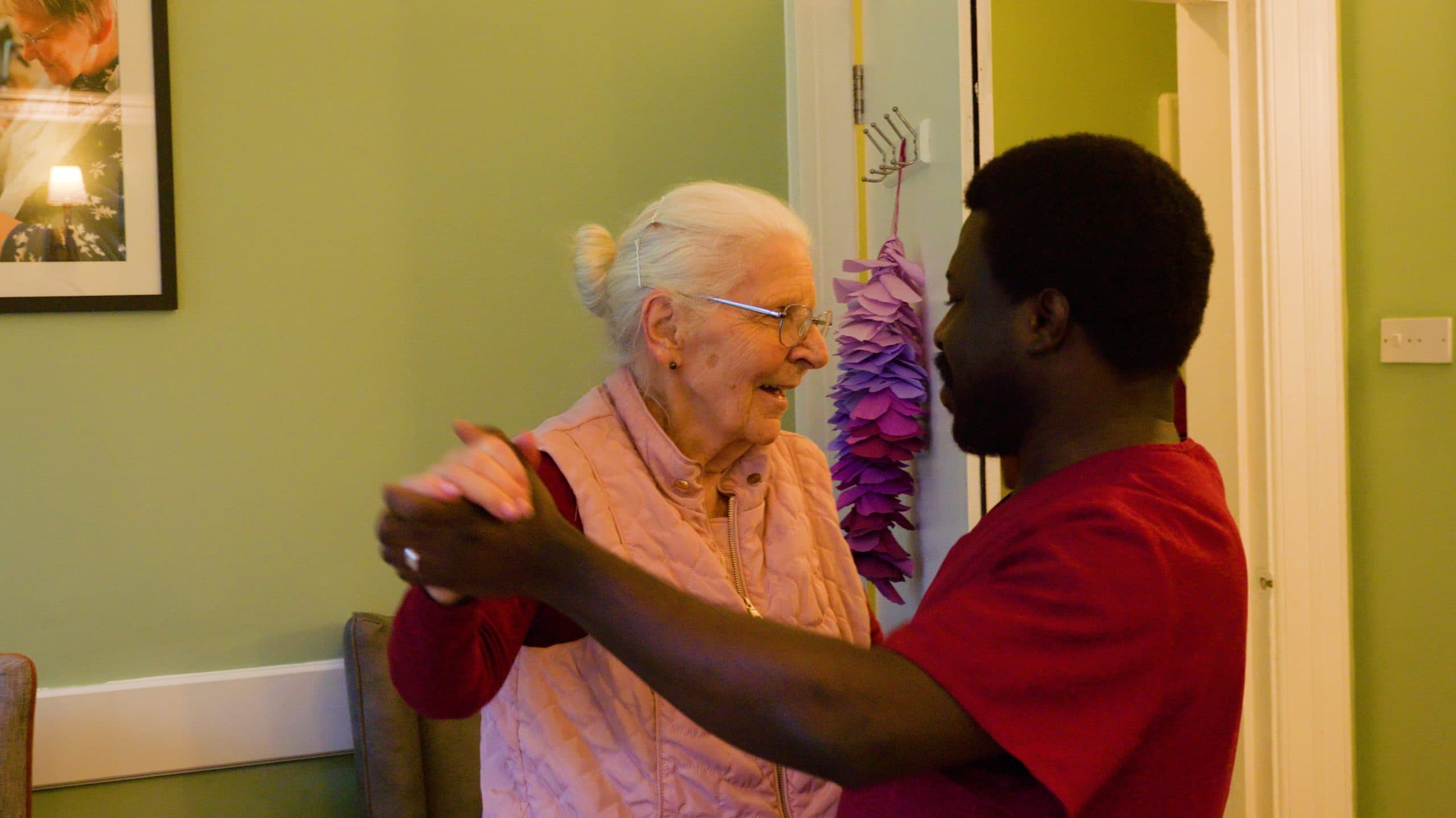 A resident dancing during an activity session